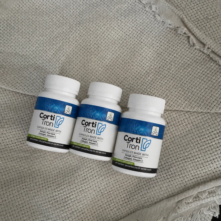 Three CortiTron bottles on fabric, real unedited photo